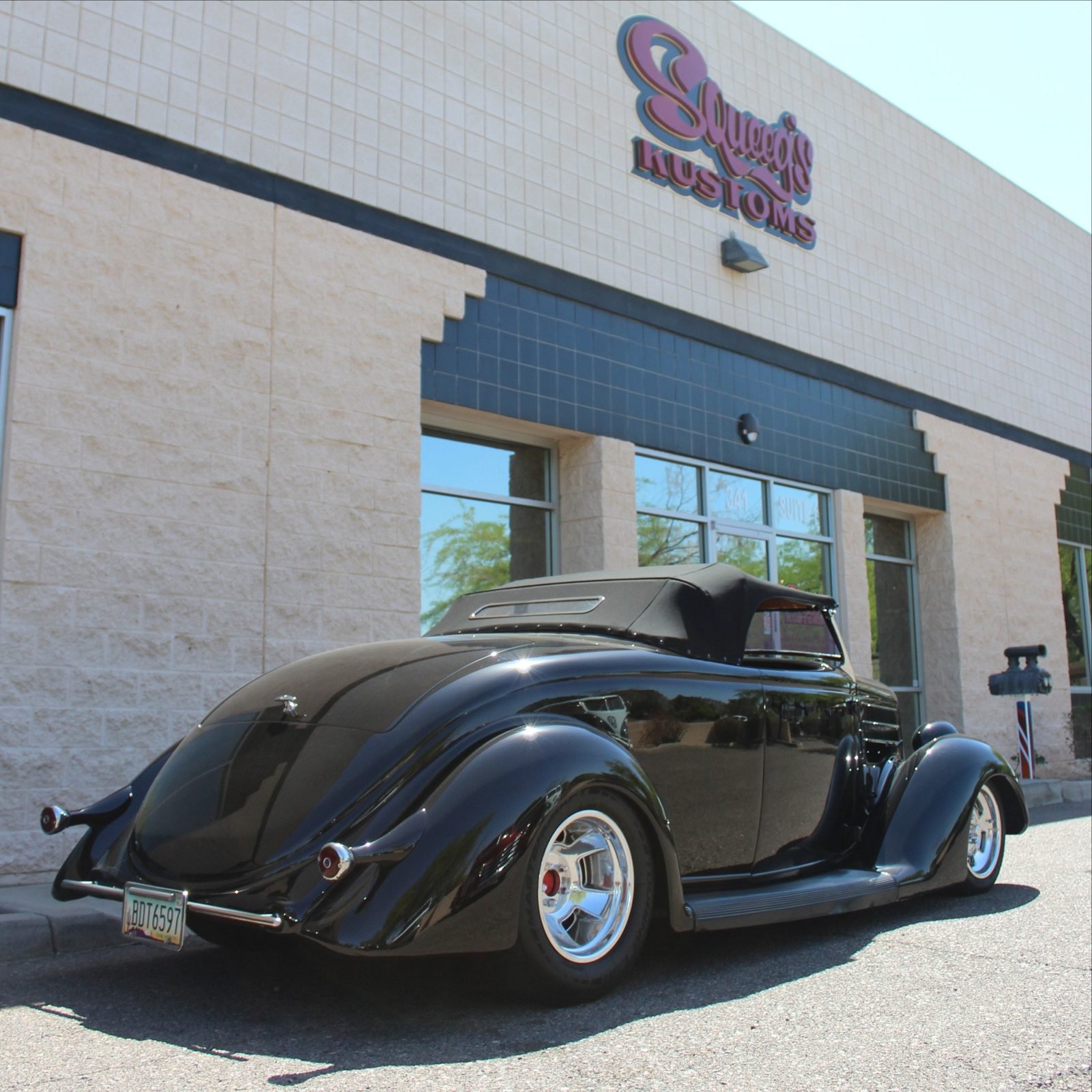 The Squeeg’s Kustoms building in Chandler, Arizona, with a black ’36 Ford out front